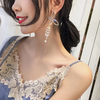 S925 nål krystal perle dingle øreringe med zink legering for kvinder øreringe koreansk mode bue perle smykker engros